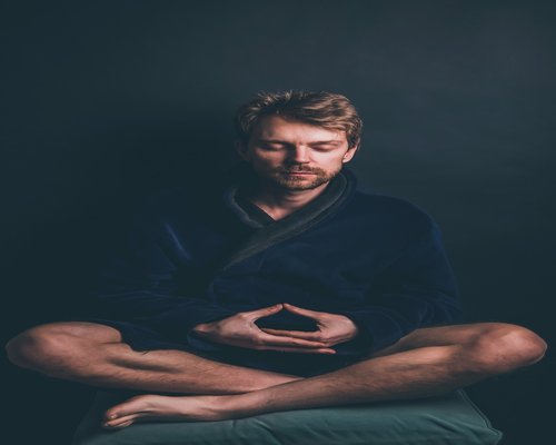 person meditating for stress management and internal balance